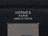 hermes ' s paris made in france logo on a black leather handbag