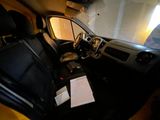 a view of the inside of a car from the driver ' s seat