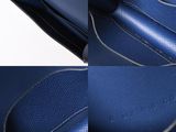 the inside of a blue purse with a zipper on it