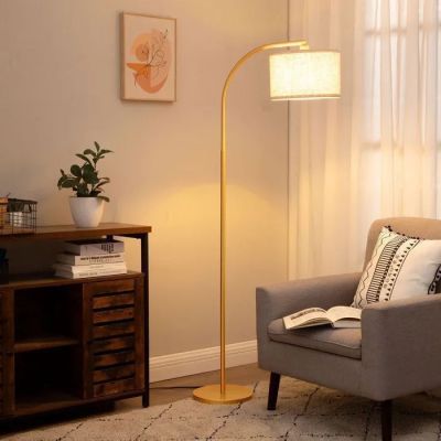 an image of a living room with a chair and a lamp