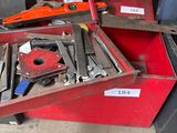 many tools in a red box on the floor