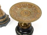 pair of antique brass candlesticks on black bases