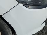 a close up of a car ' s front bumper and front bumper