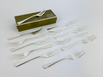 a lot of forks and spoons sitting on a table