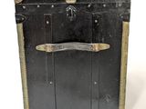 a black suitcase that is sitting on a white surface