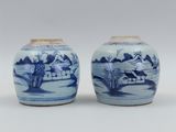 pair of chinese blue and white vases with landscape design