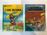 two children ' s books are sitting on a white surface
