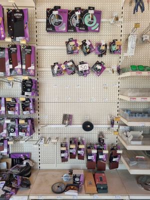 many items on the wall in the store for sale