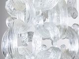 a close up of a glass chandelier hanging from a ceiling