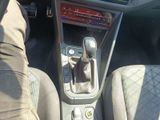a close up of a car ' s interior with a gear shift