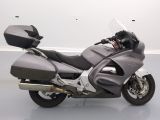 a motorcycle that is parked on the floor in a room
