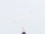 a silver necklace with a blue stone on a white background