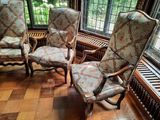 three chairs that are sitting in a room together