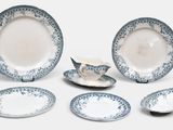 a group of blue and white plates and bowls