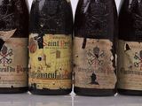 several bottles of wine are lined up on a table