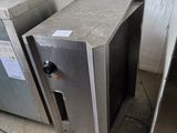 two ovens sitting next to each other in a room