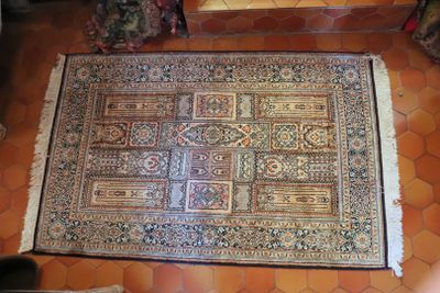 an overhead view of a rug on the floor in a living room