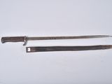 pair of old knives on a white surface with a white background