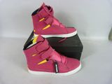 pink high top sneakers with yellow and yellow stripes on them