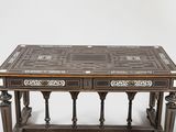 a wooden table with two drawers on top of it