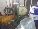 a machine that is sitting on the floor next to a trash can
