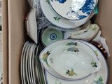 a box full of plates and bowls in it