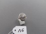 an image of a diamond ring with a price tag on top of it