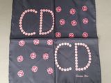 three squares with pink and white flowers on them on a table
