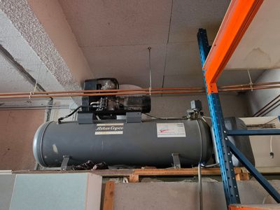 a water heater that is on the ceiling in the room
