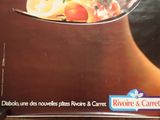 cookbook on a table with a spoon full of food on it