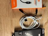 a box with a cable attached to it on a table
