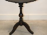 an image of a small table with a black top