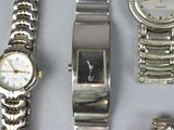 several watches and bracelets are sitting on a table