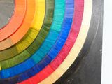 a close up of a multicolored piece of art