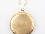 a close up of a gold locke on a white background