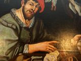 a painting of a man sitting at a table with a cat