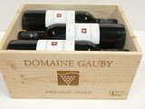 trois bouteilles du Domaine Gauby dans un coffret en bois