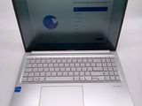 an open laptop computer sitting on top of a white table
