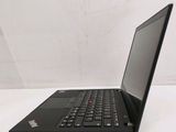 laptop computer sitting on a white surface with a white background