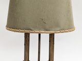 a lamp that is sitting on a table with a lamp shade on it