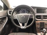 the interior of a car with a steering wheel and dashboard controls