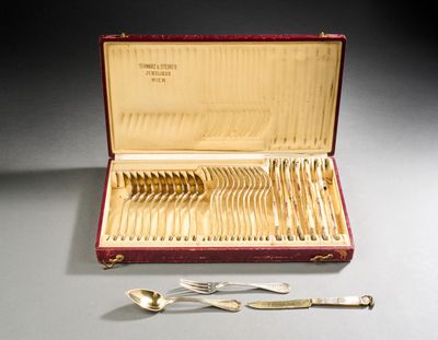 a red case with silverware in it on a table