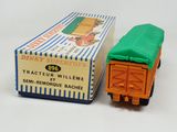 a small toy truck with a green cover on top of it