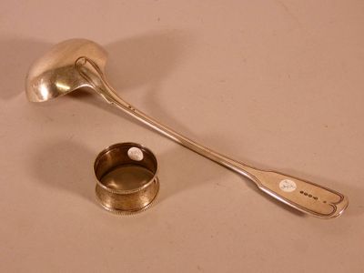 a spoon and a spoon rest on a table