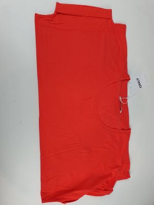 a close up of a red t - shirt on a white surface