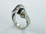 silver ring with a blue stone in the middle of it