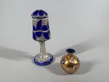 two vases sitting next to each other on a table
