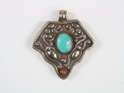 an image of a silver pendant with a turquoise stone in the center