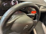 a steering wheel and dashboard of a car in a showroom