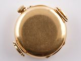 an image of a gold pocket watch on a white surface